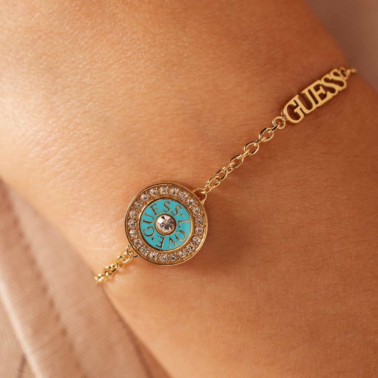 Guess stainless steel goldplated fantasiearmband met zirkonia voor dames