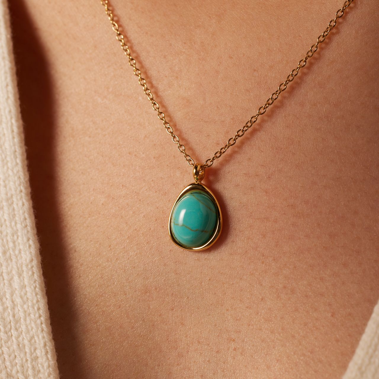 Stainless steel goldplated ketting met turquoise ovaal