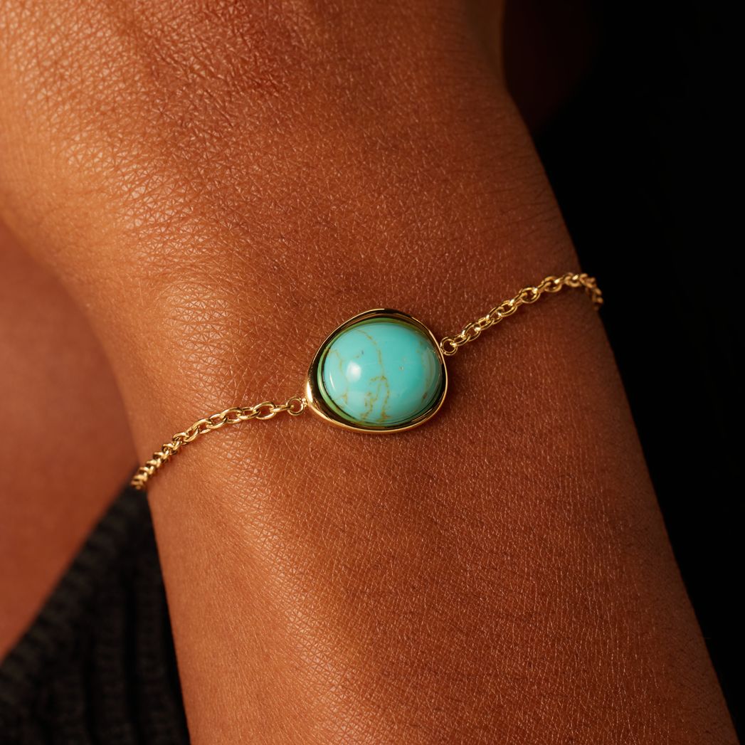 Stainless steel goldplated armband met turquoise ovaal