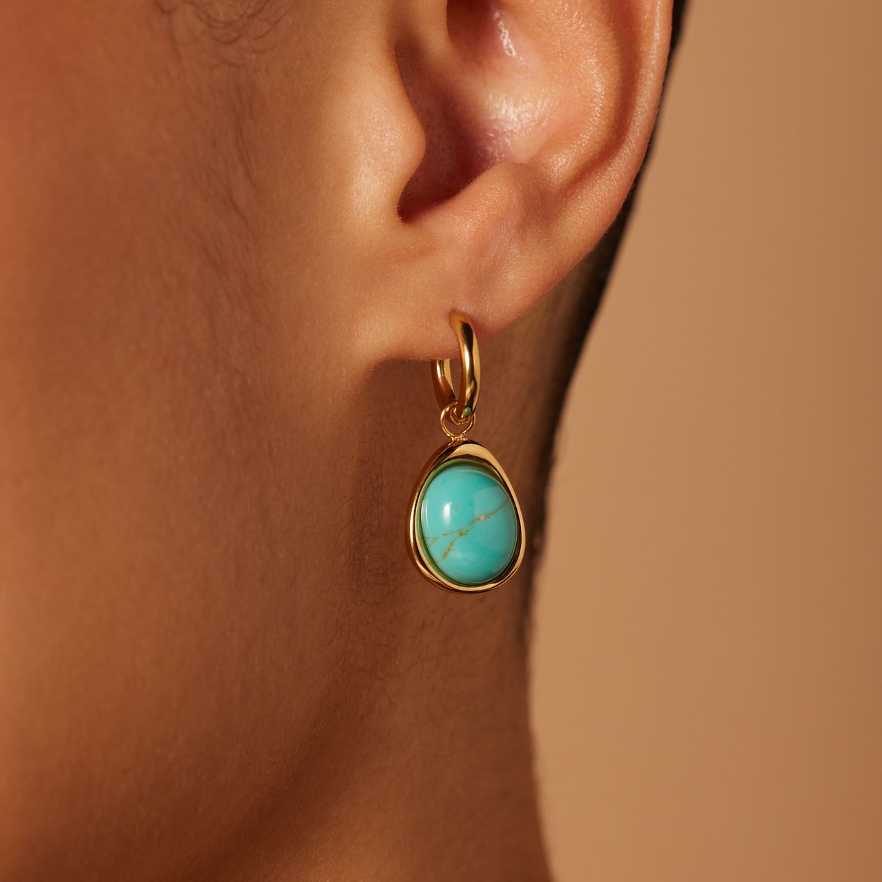 Stainless steel goldplated oorbellen met turquoise ovaal