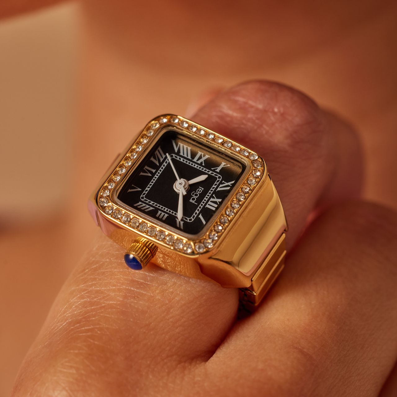 Regal Ringuhr, Gold, mit schwarzem Zifferblatt und Zirkoniasteinen