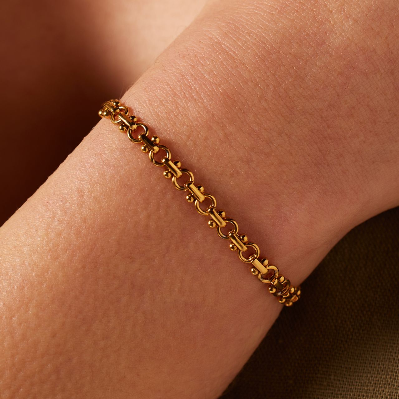 Stainless steel goldplated schakelarmband voor dames