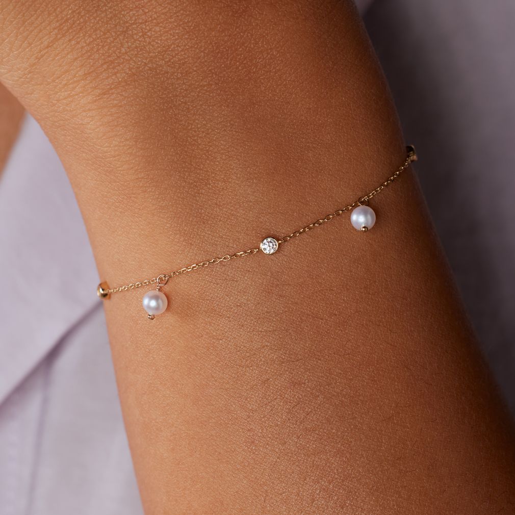 14 karaat gouden armband met zirkonia en zoetwaterparel