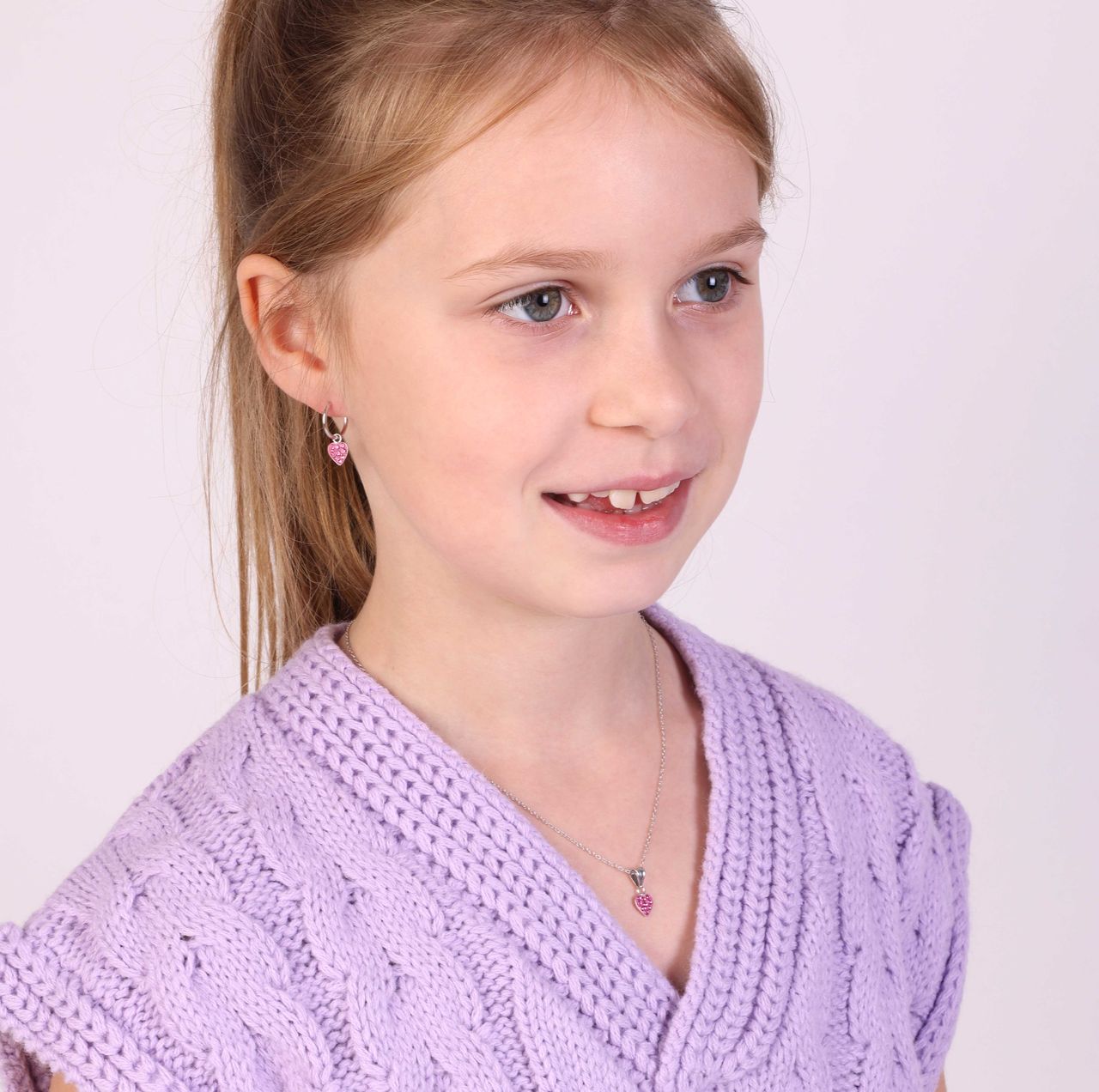 Zilveren kinderoorbellen hart met rose kristal