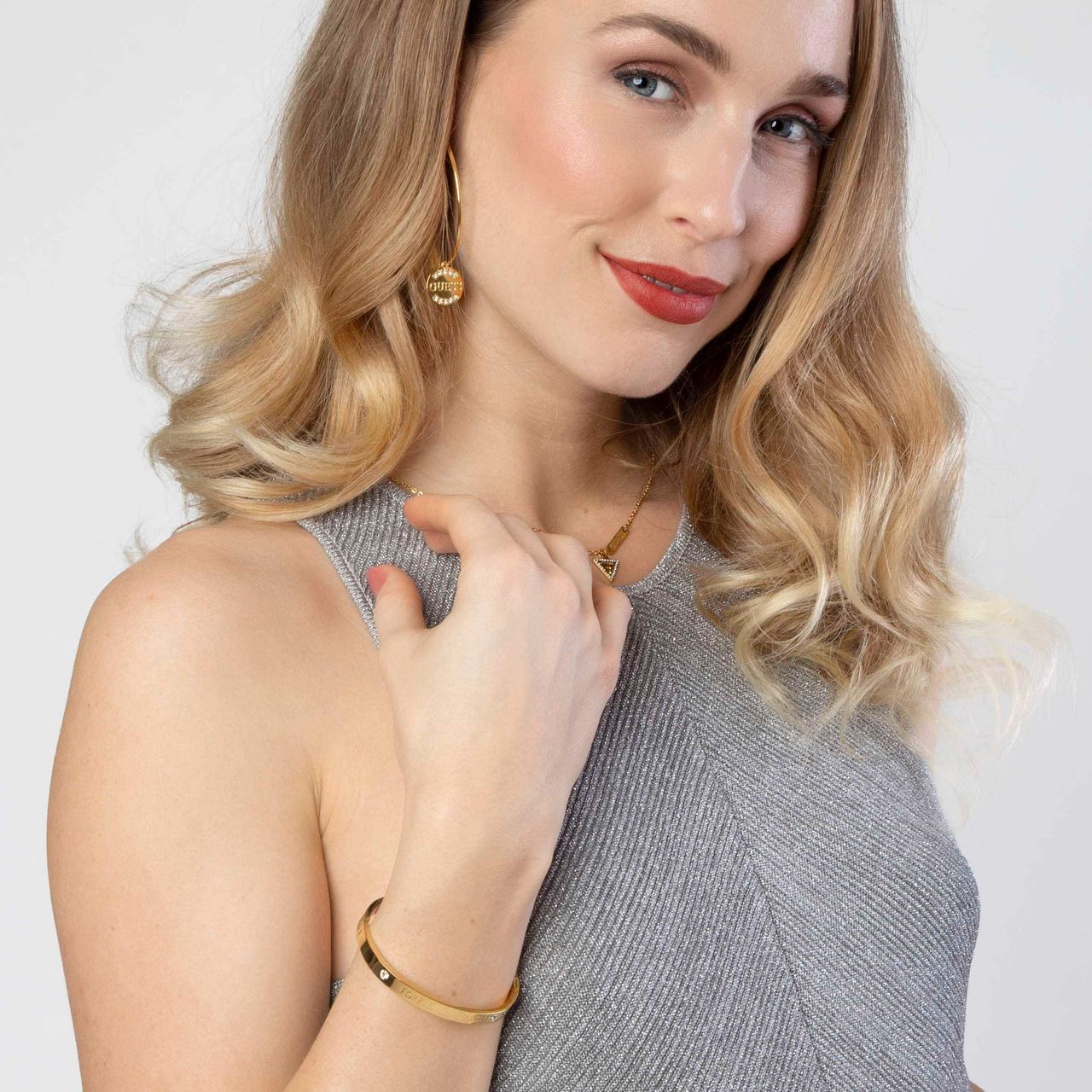 Guess stalen goldplated oorringen met hanger met kristal voor dames