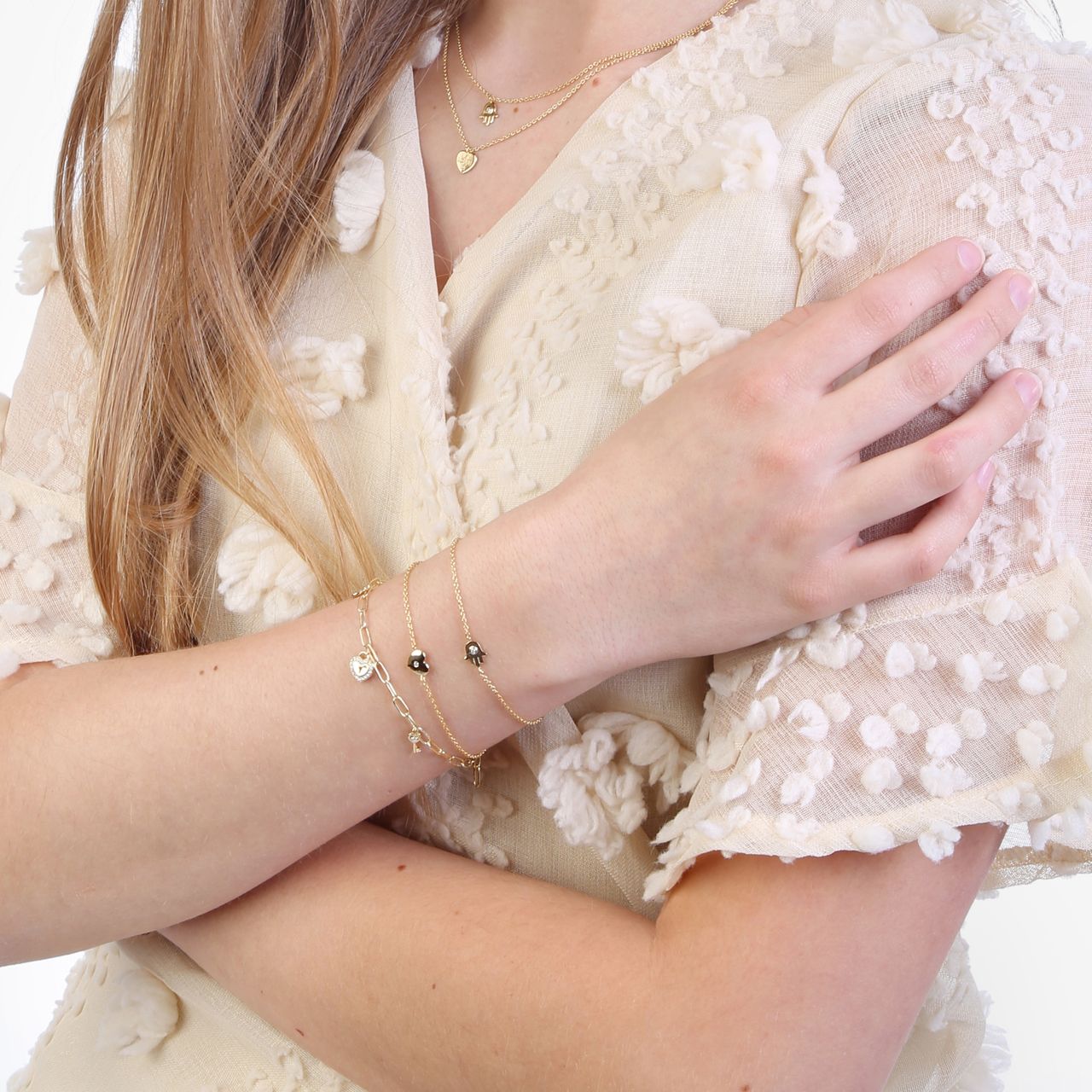 Zilveren goldplated bedelarmband key