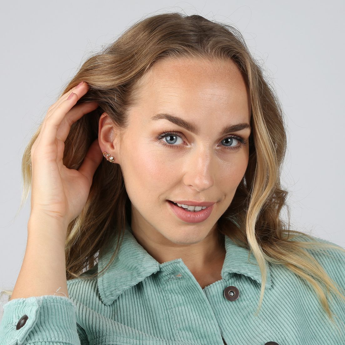 Zilveren goldplated oorknop doodshoofd