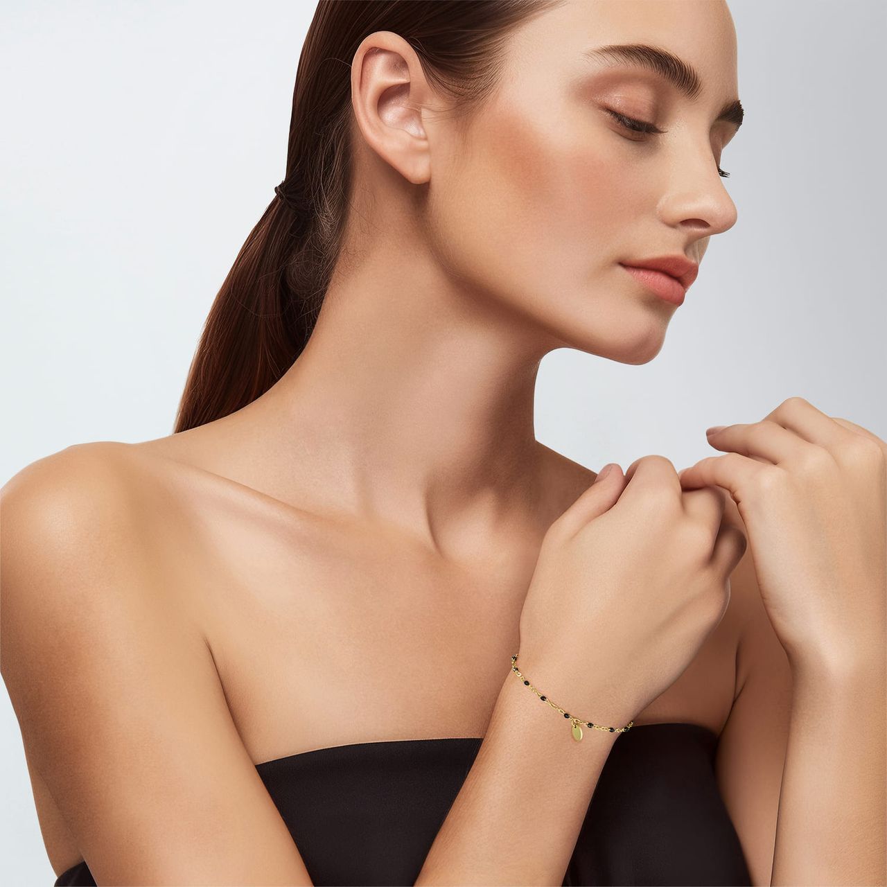 Stainless steel goldplated kralenarmband met zwart emaille voor dames