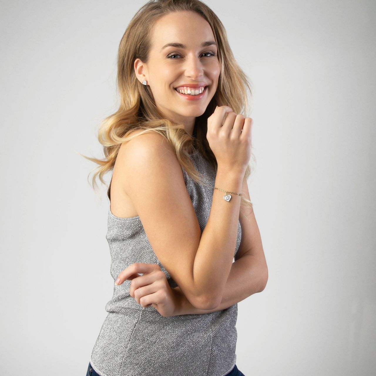 Guess stainless steel goldplated bedelarmband met hanger hart met kristal voor dames