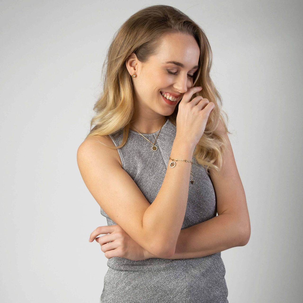 Guess stainless steel goldplated bedelarmband met hanger met kristal voor dames