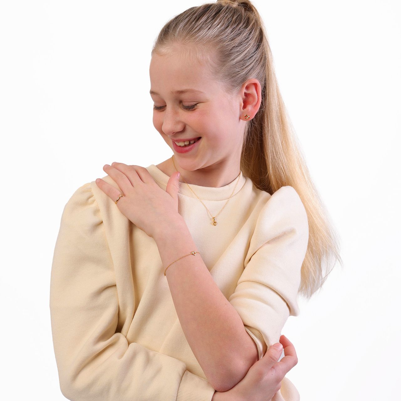 Zilveren goldplated kinderoorknoppen hart met zirkonia