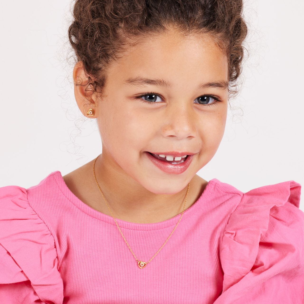 Zilveren goldplated kinderoorknoppen hart met zirkonia