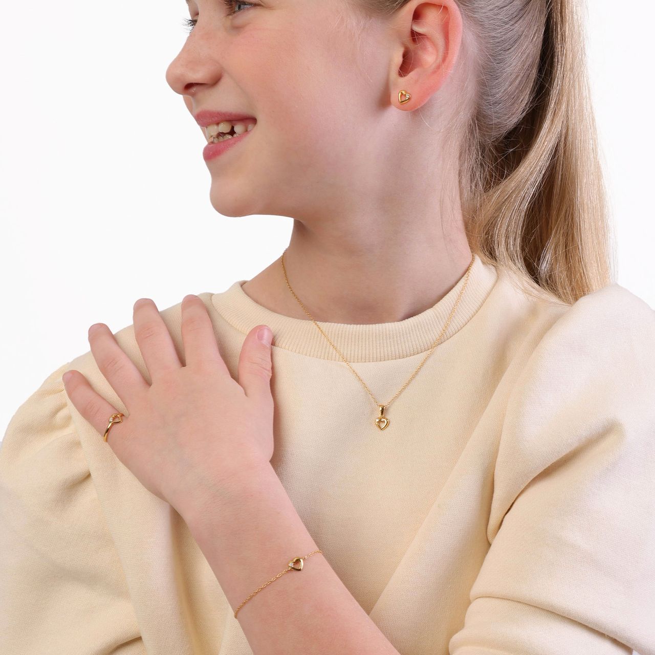 Zilveren kinderring gold met open hart en zirkonia