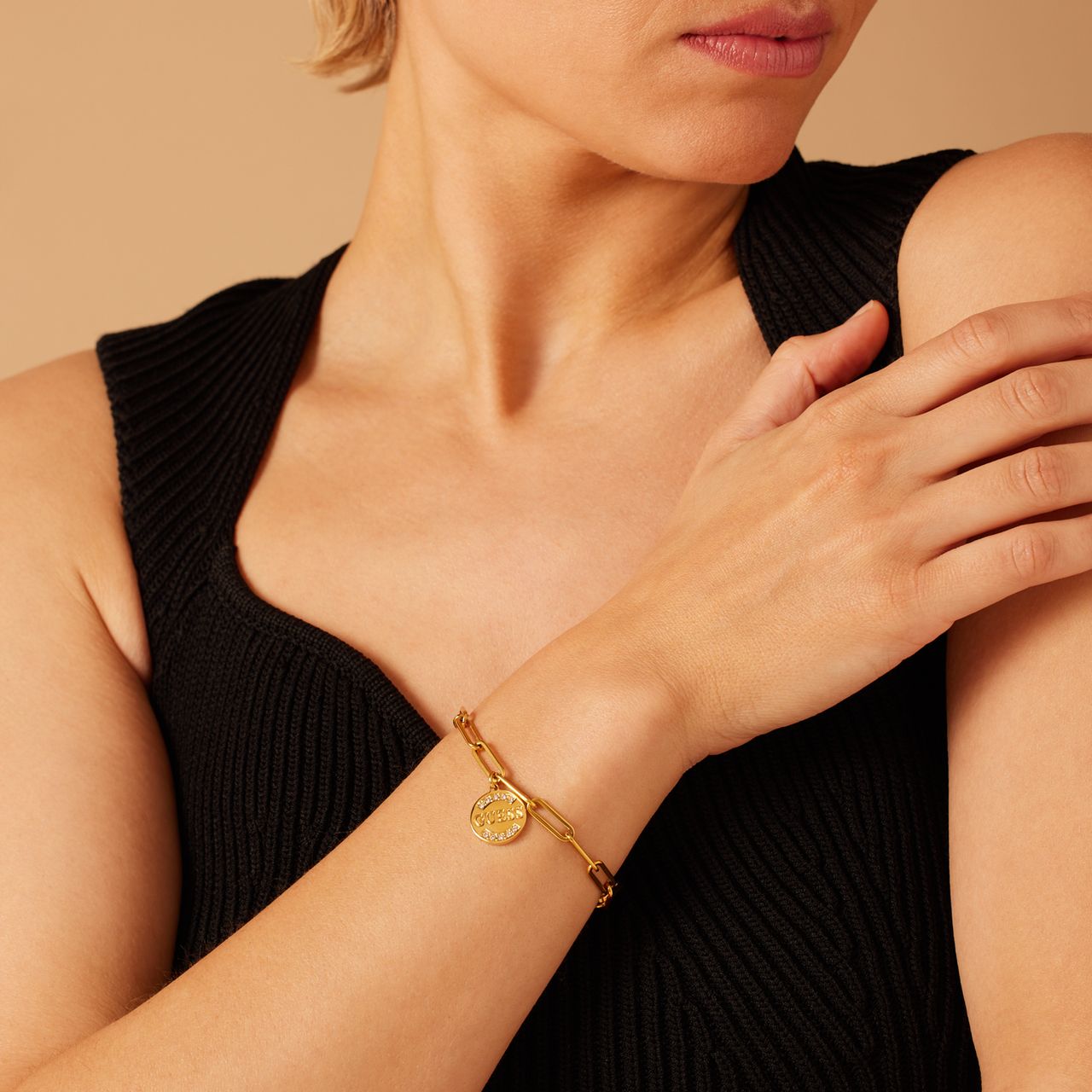 Guess stalen goldplated schakelarmband met hanger met kristal voor dames