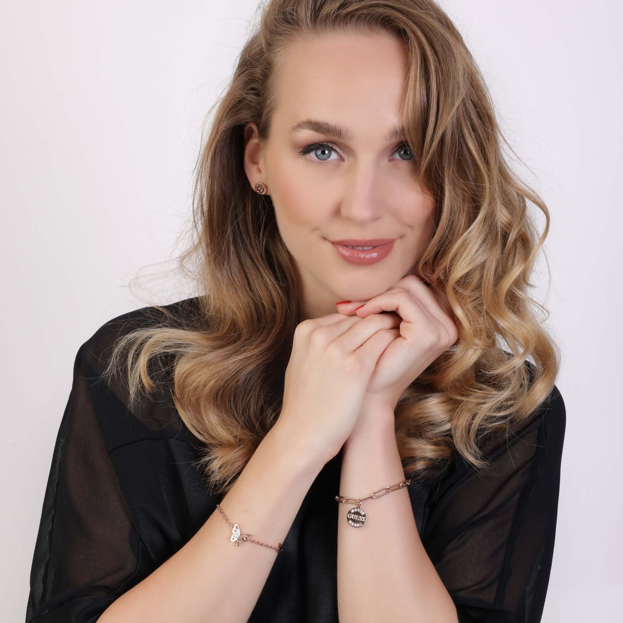 Guess stainless steel roséplated schakelarmband met hanger met kristal voor dames