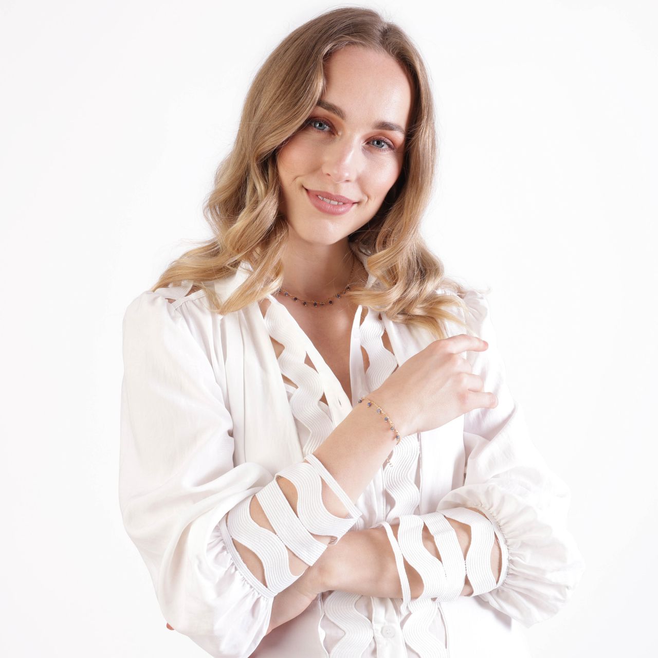 Stainless steel goldplated fantasiearmband met hanger met blauwadersteen voor dames