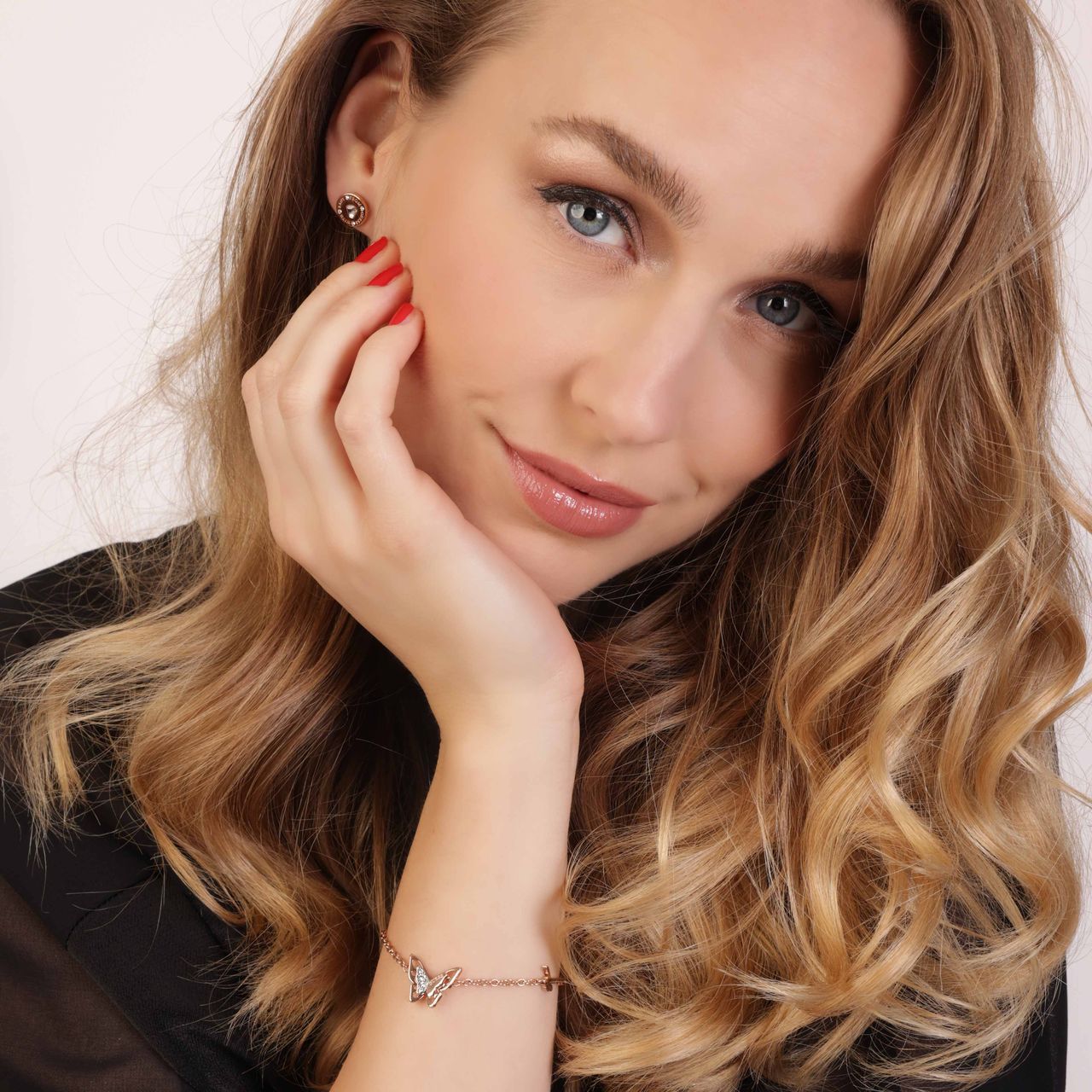 Guess stainless steel roséplated fantasiearmband met hanger vlinder met kristal voor dames