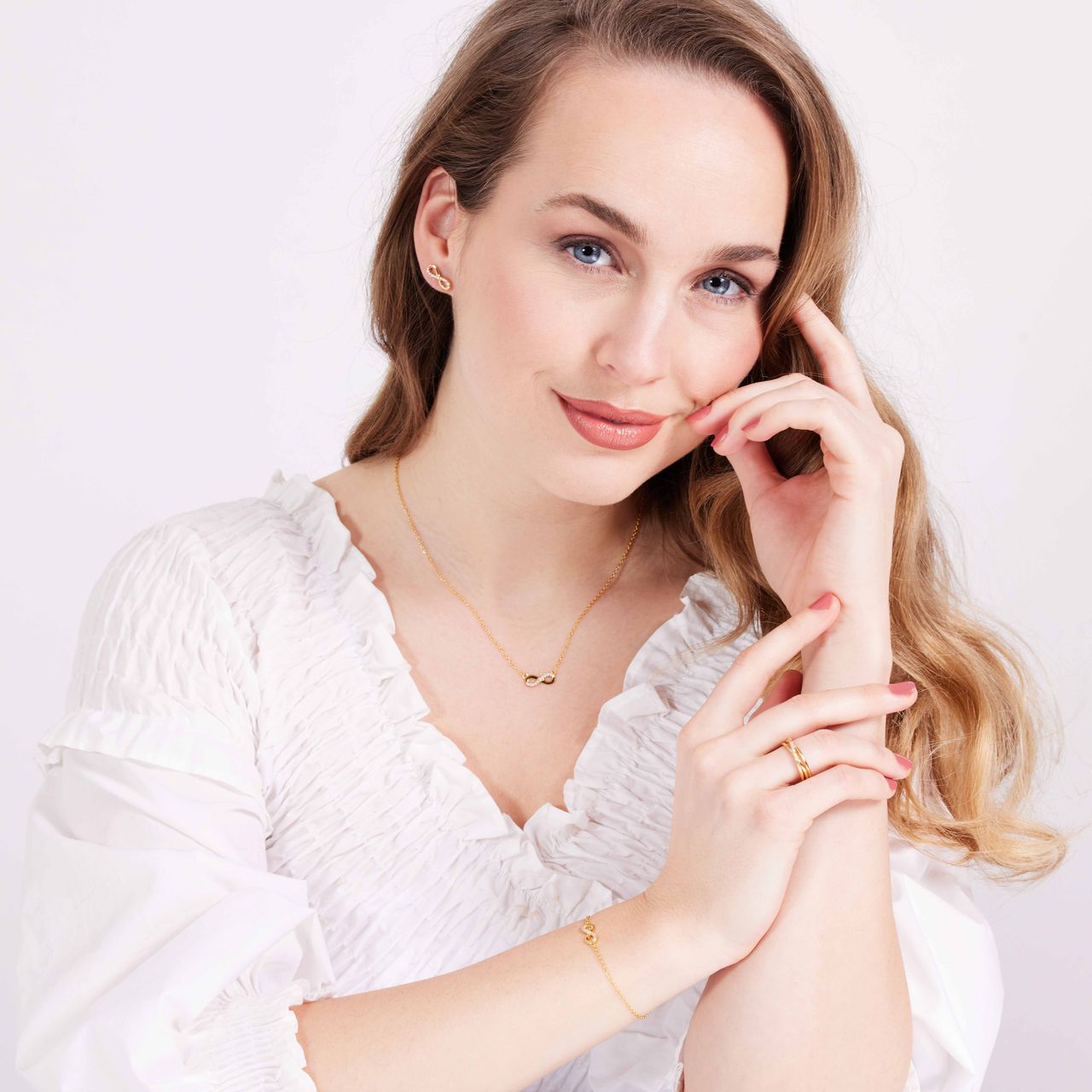 Zilveren goldplated oorknoppen infinity zirkonia voor dames