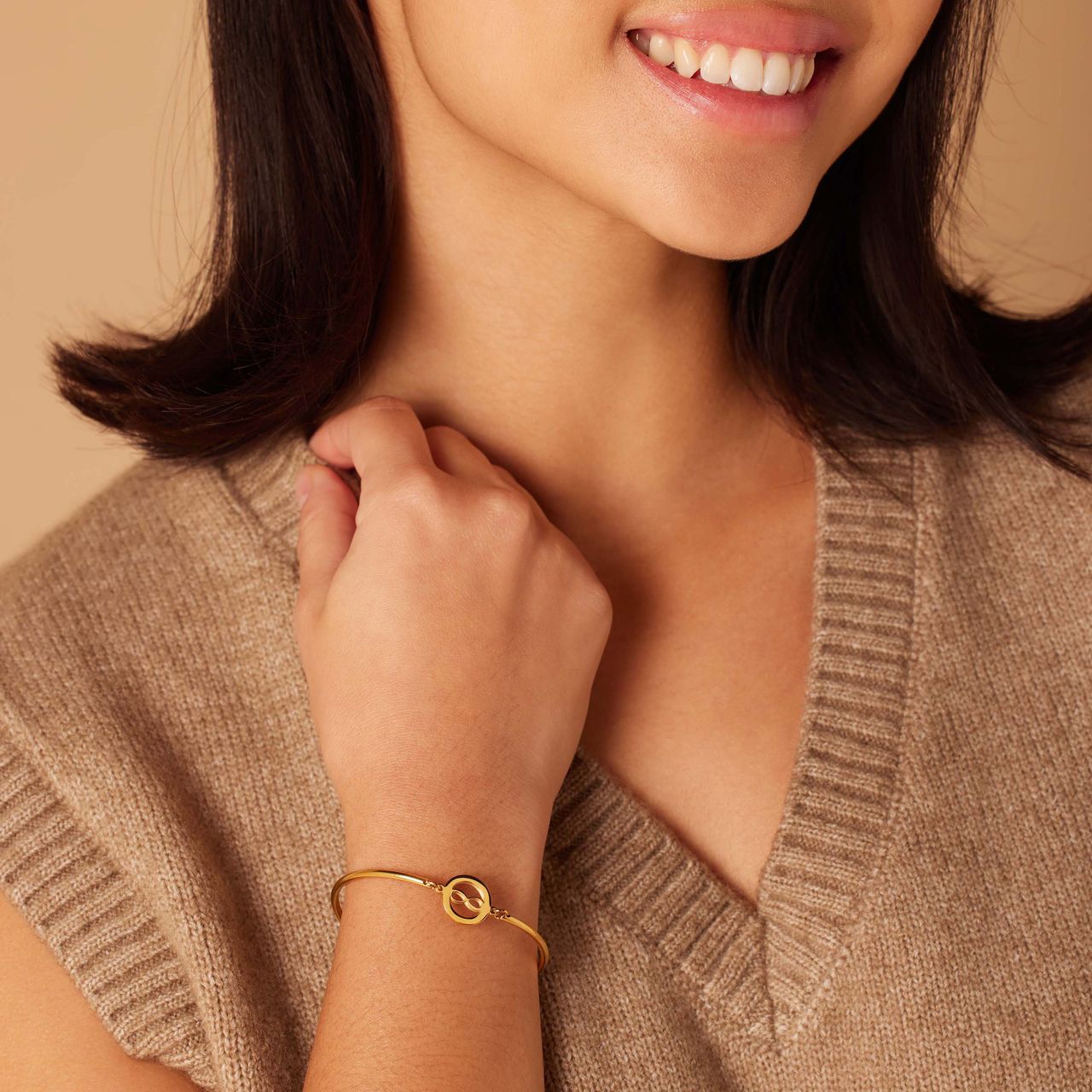 Stainless steel goldplated armband met open infinity