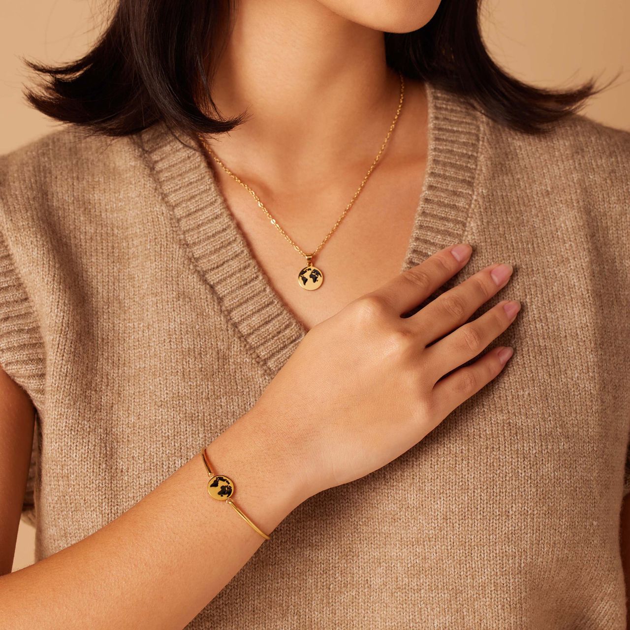 Stainless steel goldplated armband met wereldbol