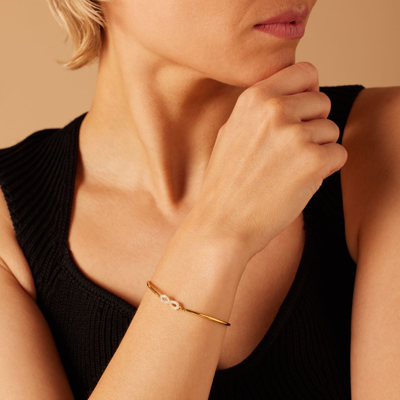 Stalen goldplated armband infinity met kristal