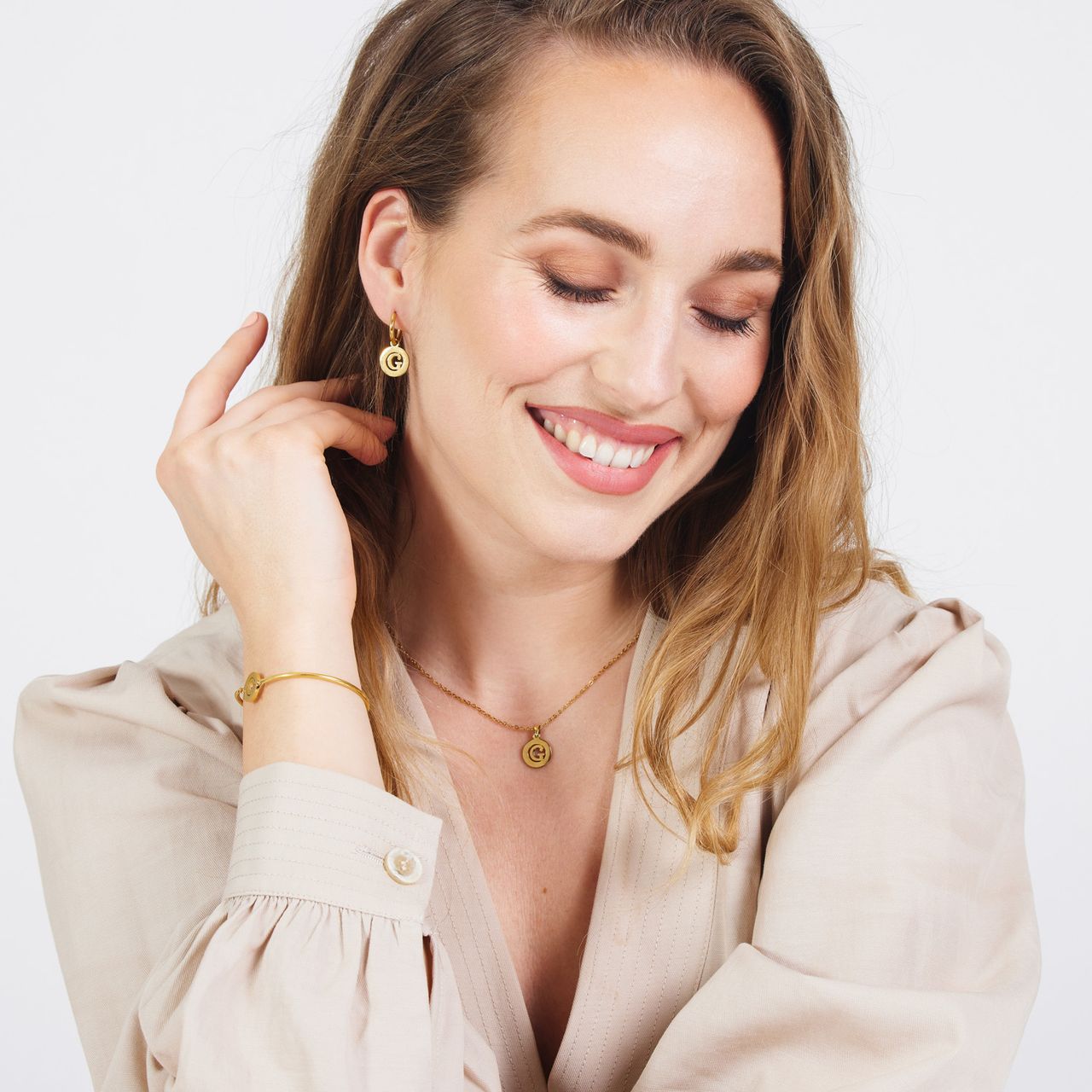 Stainless steel goldplated oorringen met letterhanger G voor dames