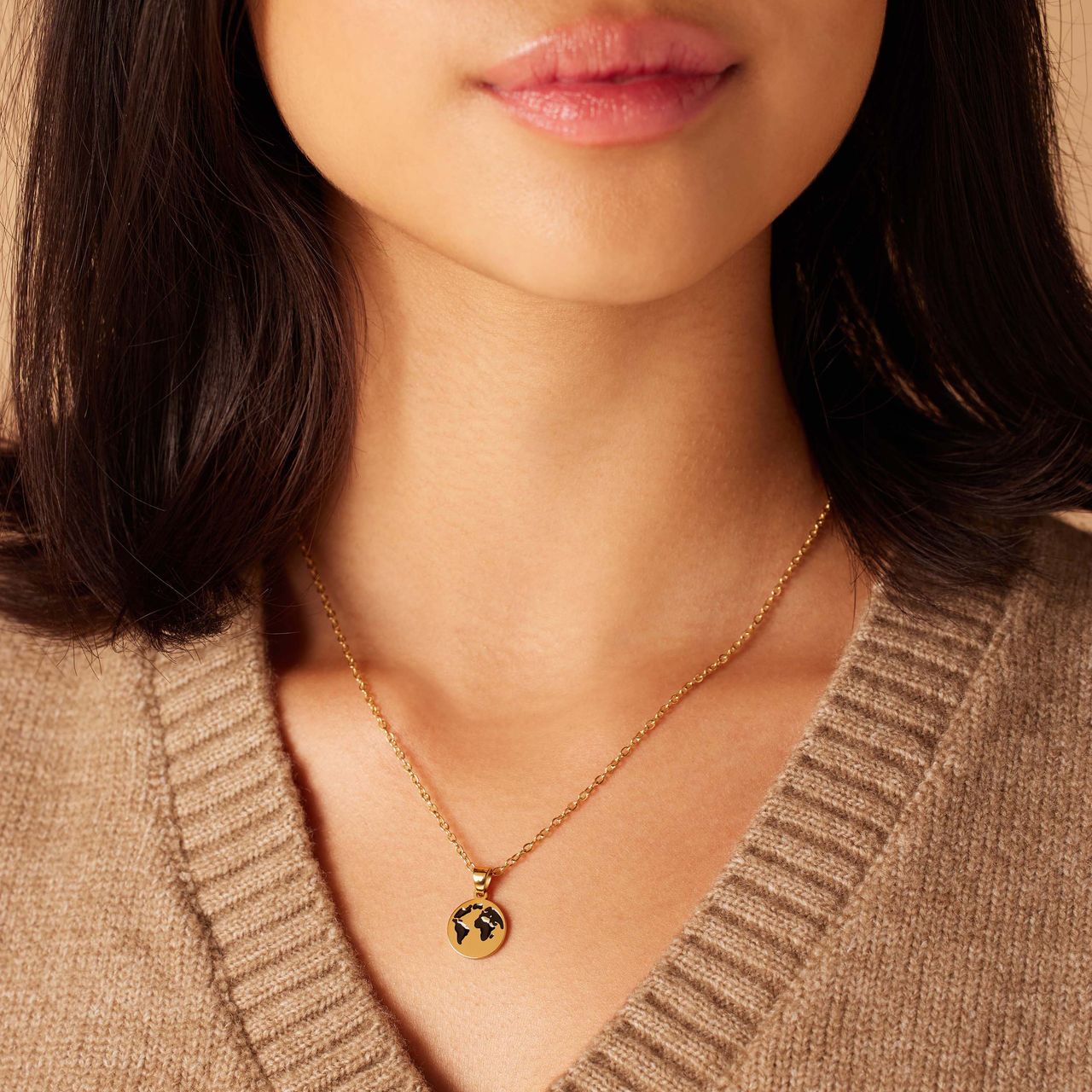 Stainless steel goldplated ketting met hanger wereldbol
