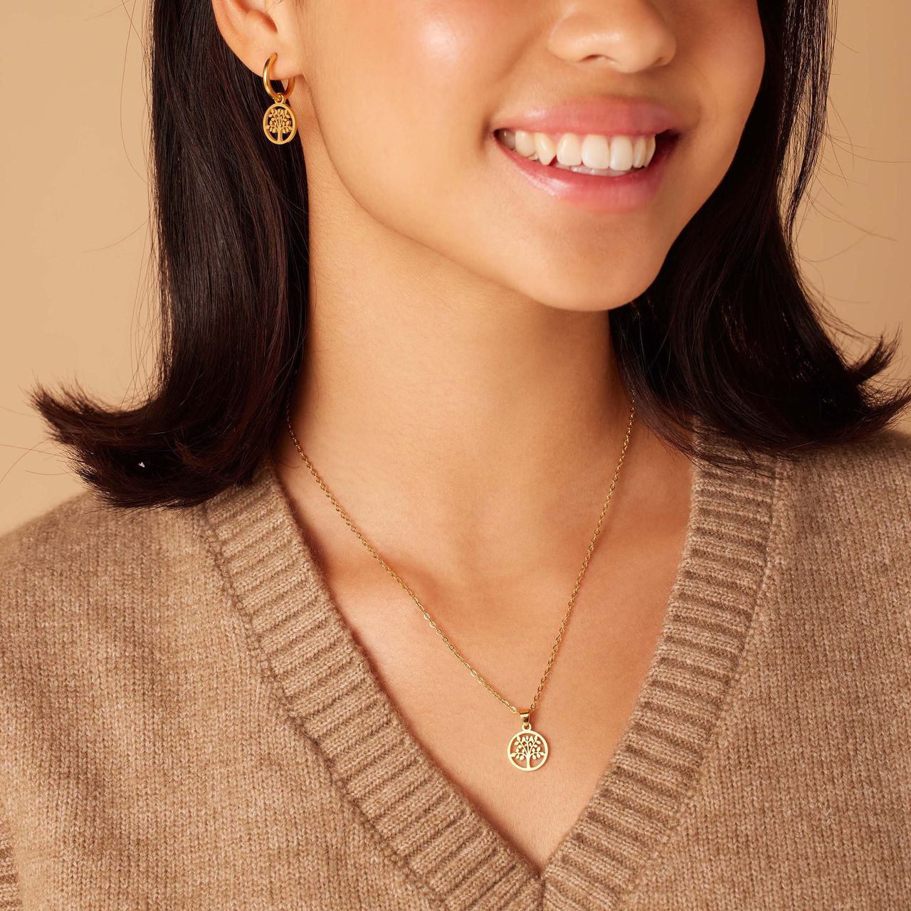 Stainless steel goldplated oorringen met munt voor dames