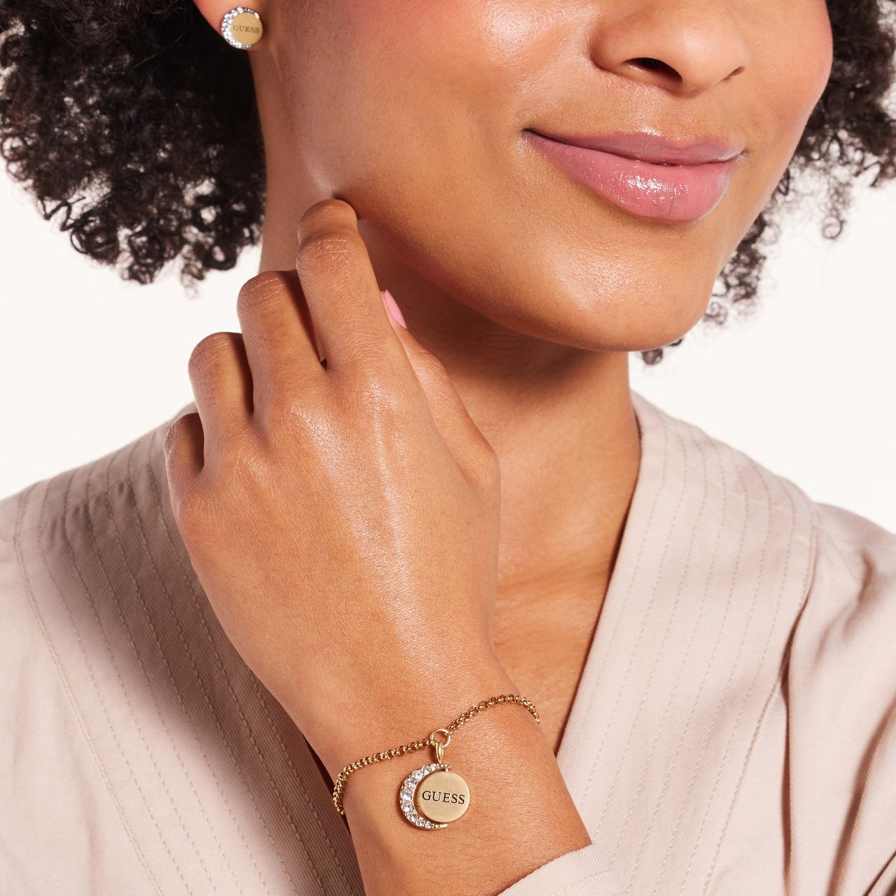 Guess stainless steel goldplated schakelarmband met kristal voor dames