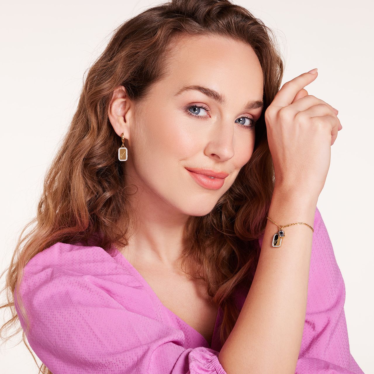 Guess stainless steel goldplated schakelarmband met kristal voor dames