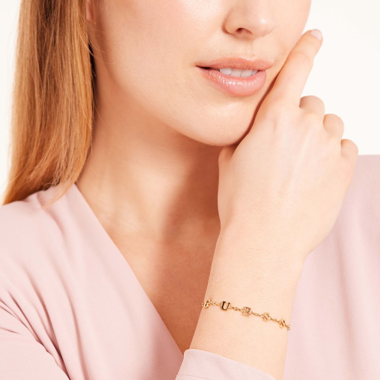 Guess stainless steel goldplated schakelarmband met kristal voor dames