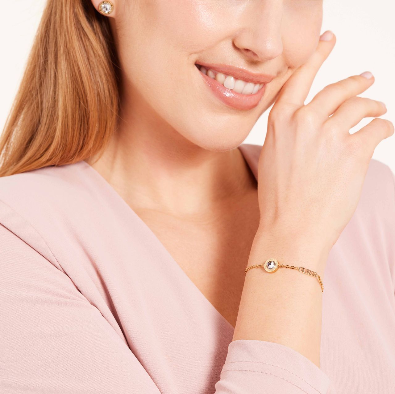 Guess stainless steel goldplated armband met hanger met kristal voor dames