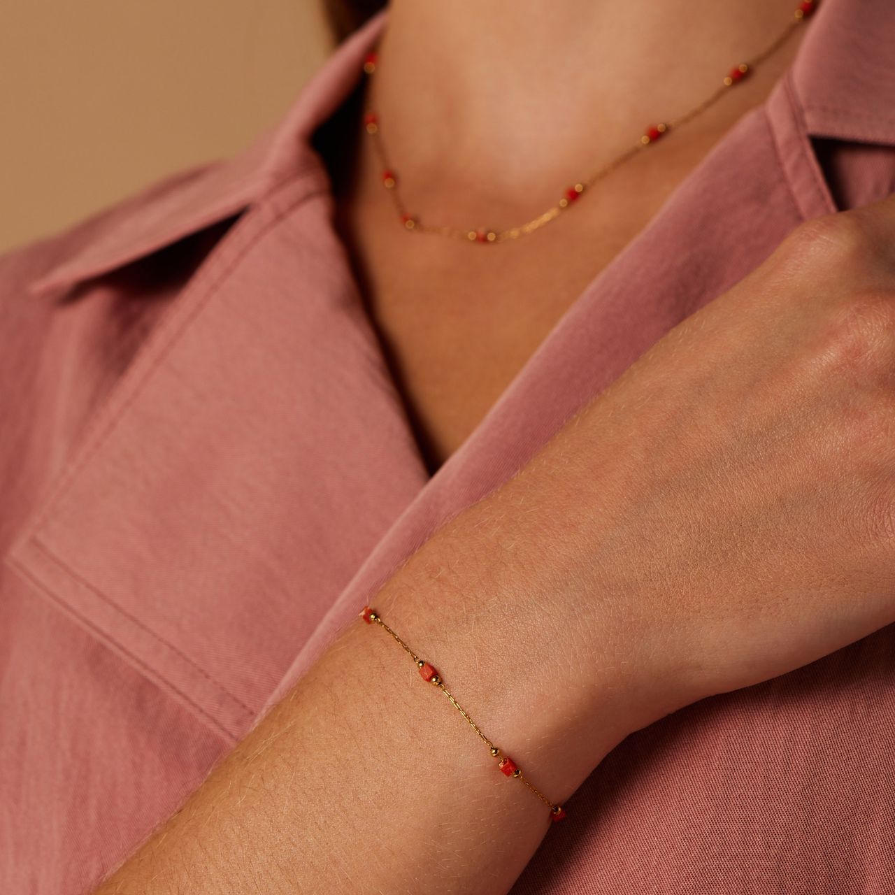 Stalen goldplated armband met oranje stenen