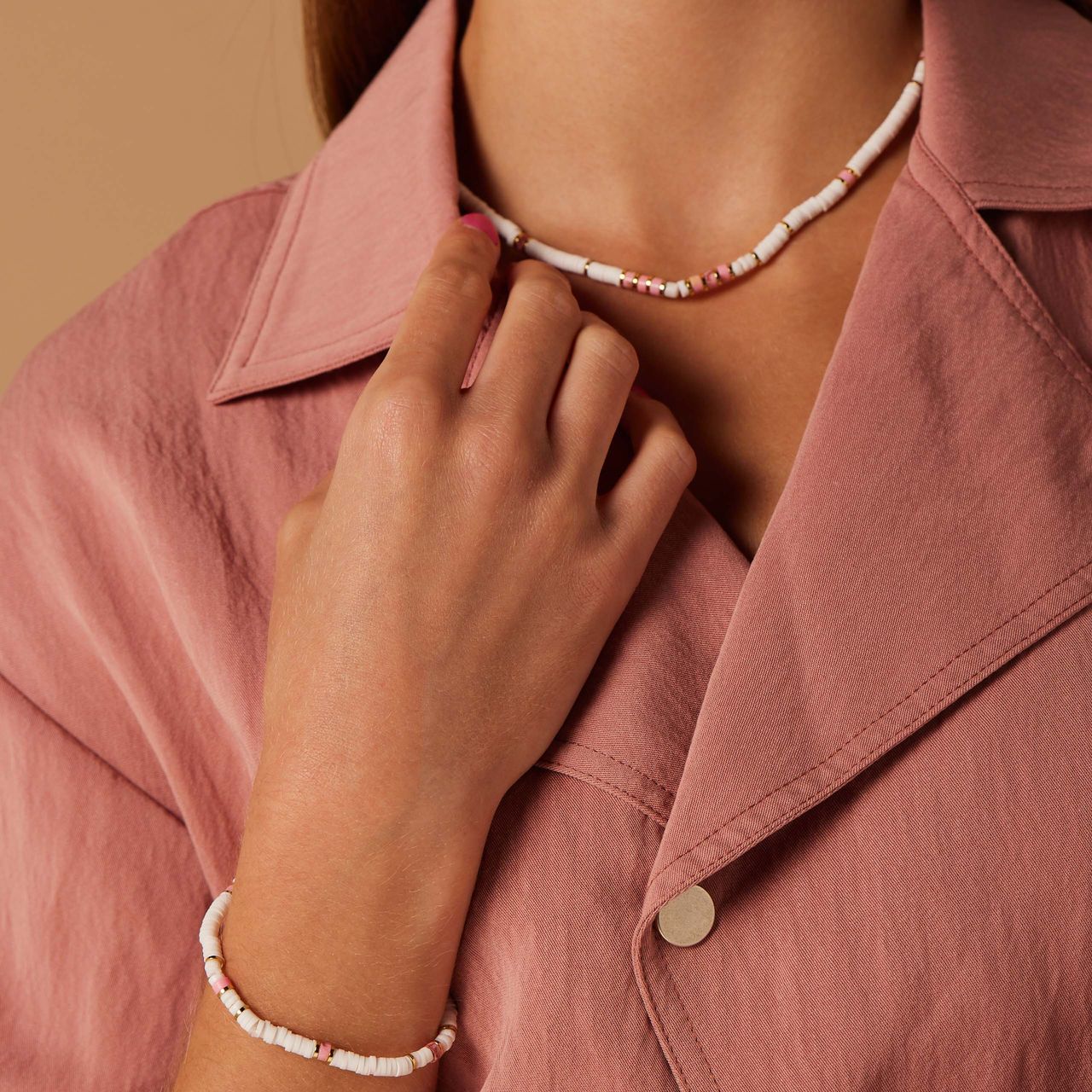 Stainless steel goudkleurige armband wit en roze