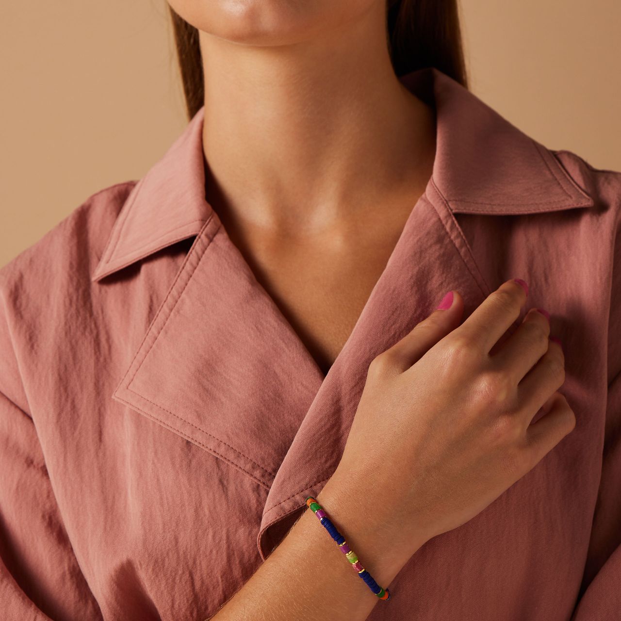 Stalen goldplated armband met blauwe kralen