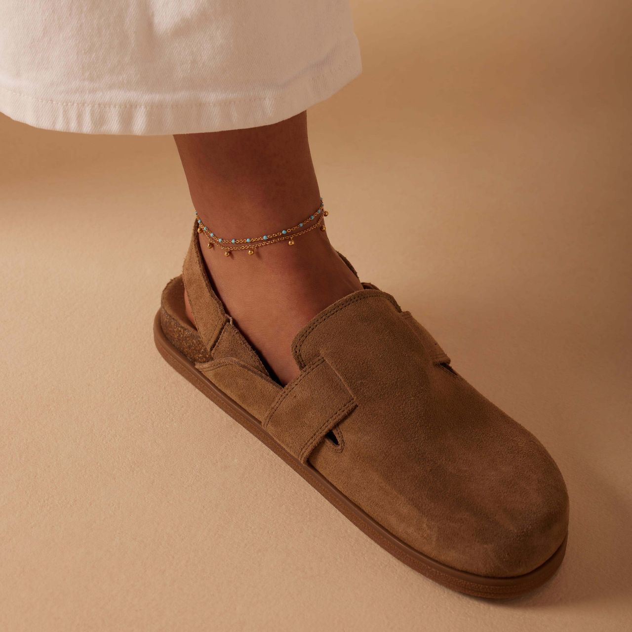 Dubbele goldplated stalen enkelband met bedeltjes