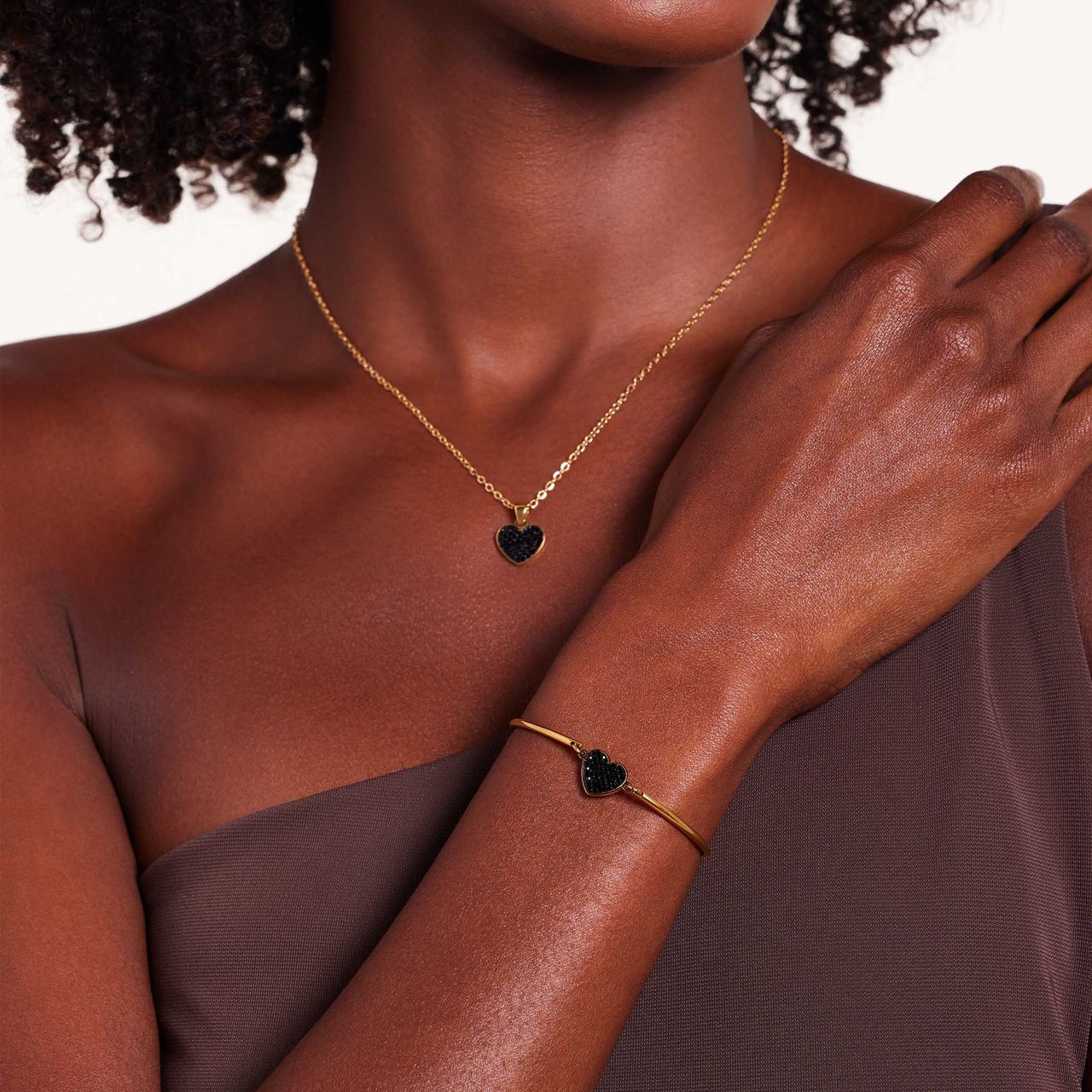 Stainless steel goldplated fantasiearmband met hanger hart met zwart kristal voor dames