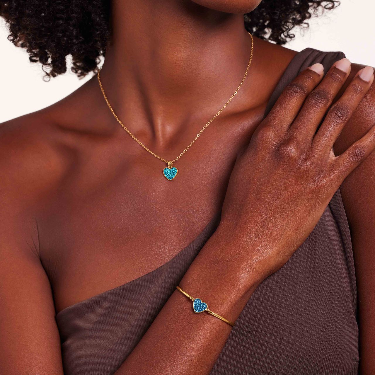 Stalen goldplated armband hart met kristal aqua