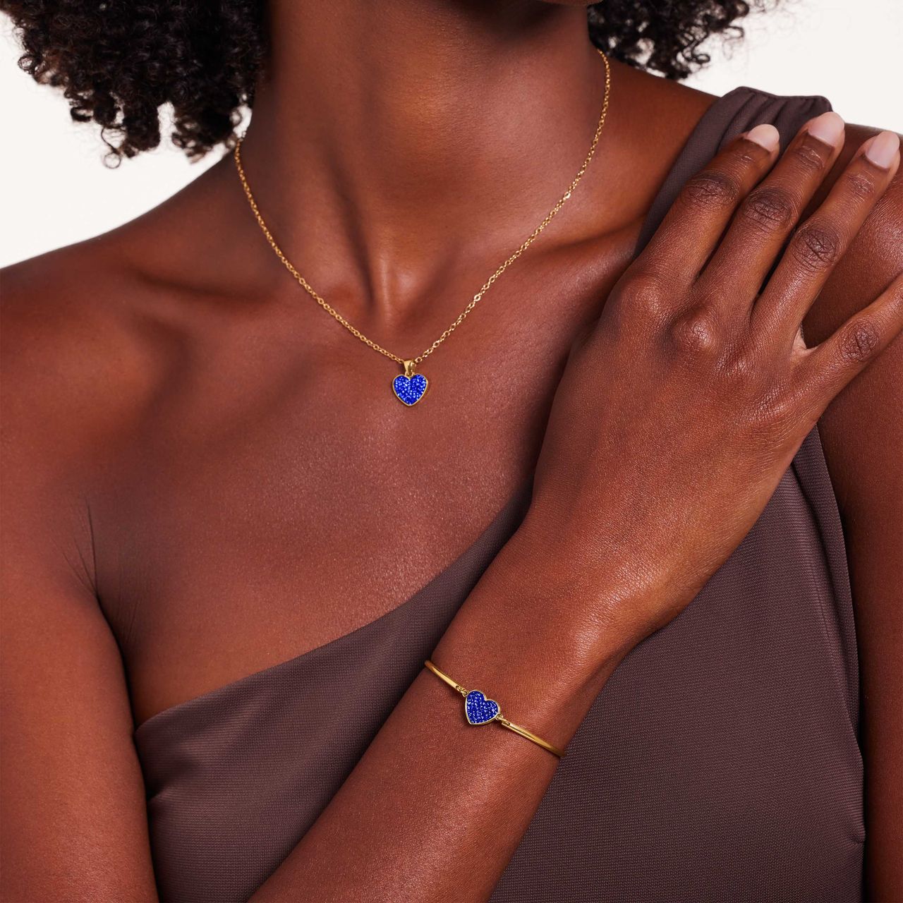 Stainless steel goldplated fantasiearmband met hanger hart met blauw kristal voor dames