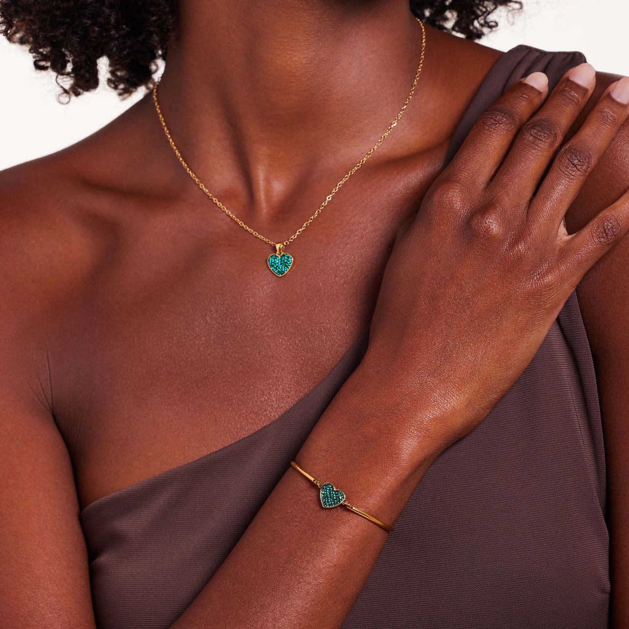 Stainless steel goldplated fantasiearmband met hanger hart met groen kristal voor dames