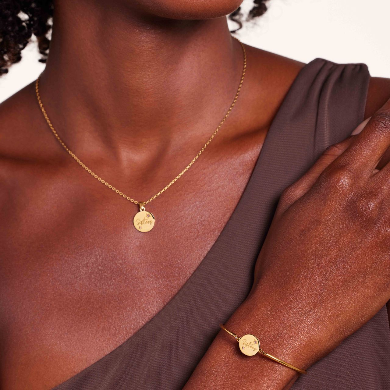 Stainless steel goldplated armband sisters