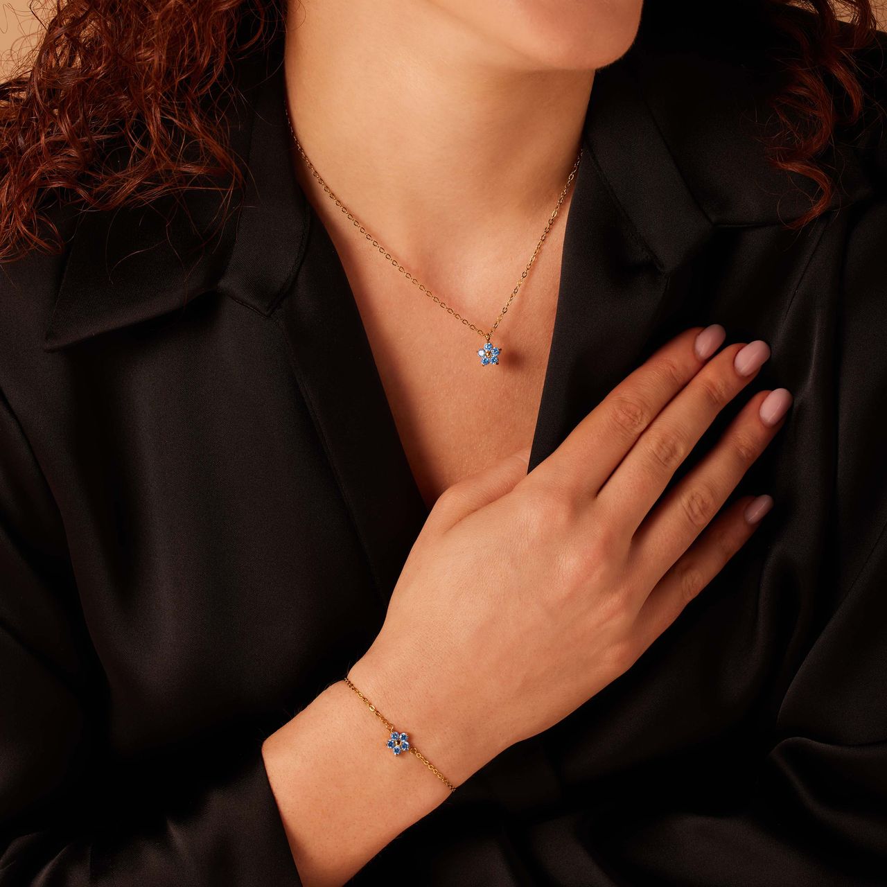Stainless steel goldplated armband bloem met zirkonia aqua