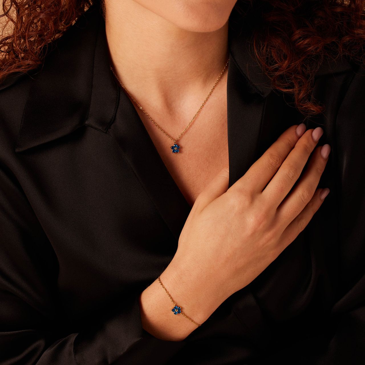 Stainless steel goldplated armband bloem zirkonia blue topaz