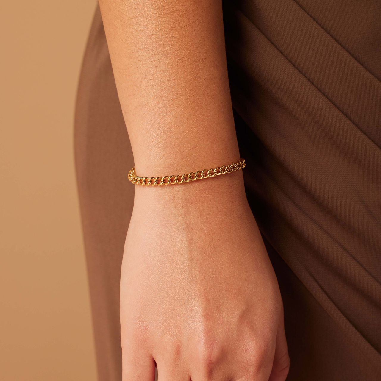 Stainless steel goldplated schakelarmband 4mm