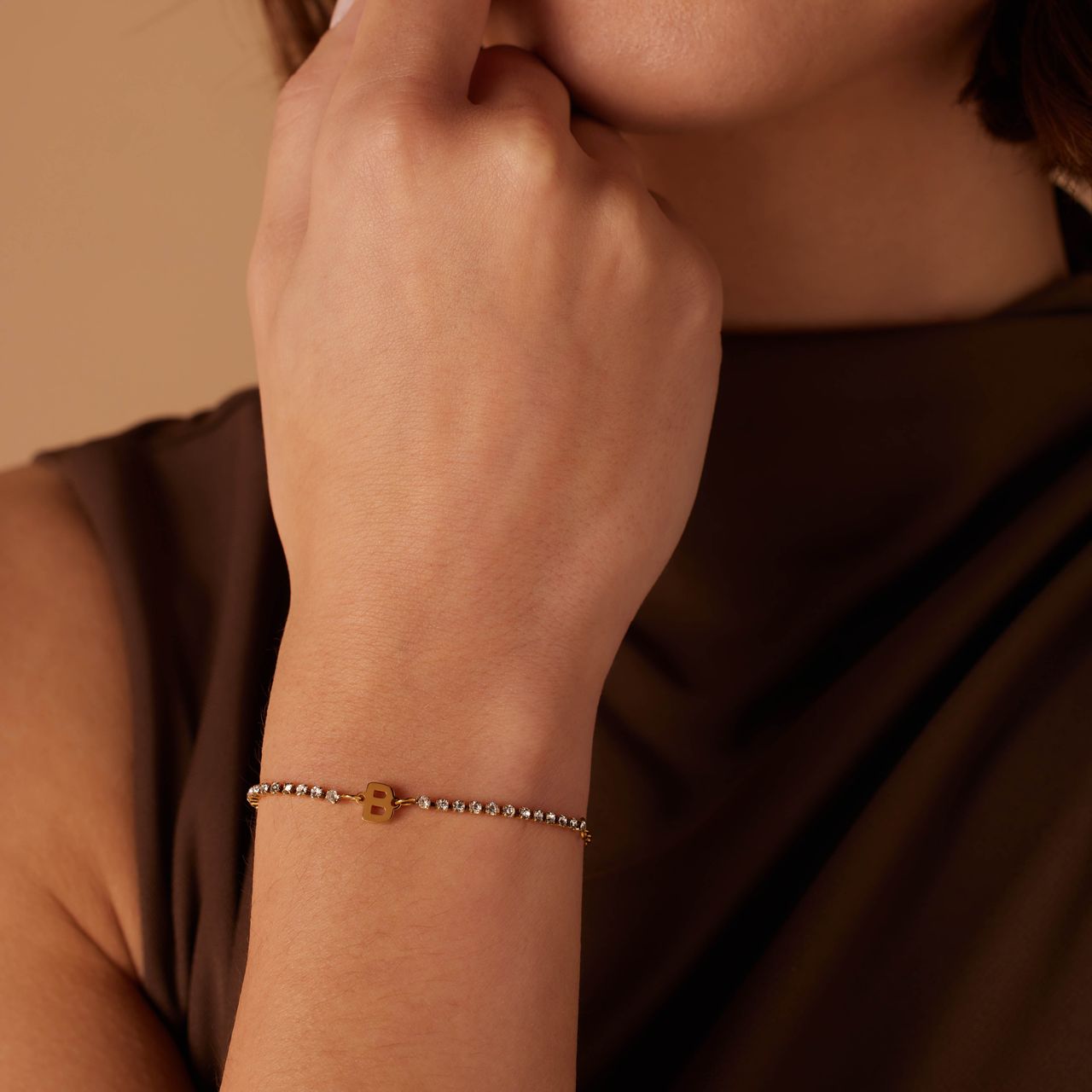 Stalen goldplated tennis armband wit cz letter - B