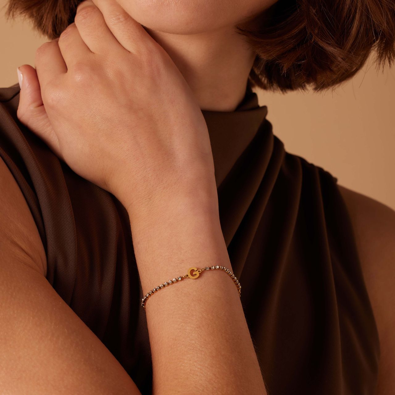 Stainless steel goldplated tennis armband wit cz letter - G