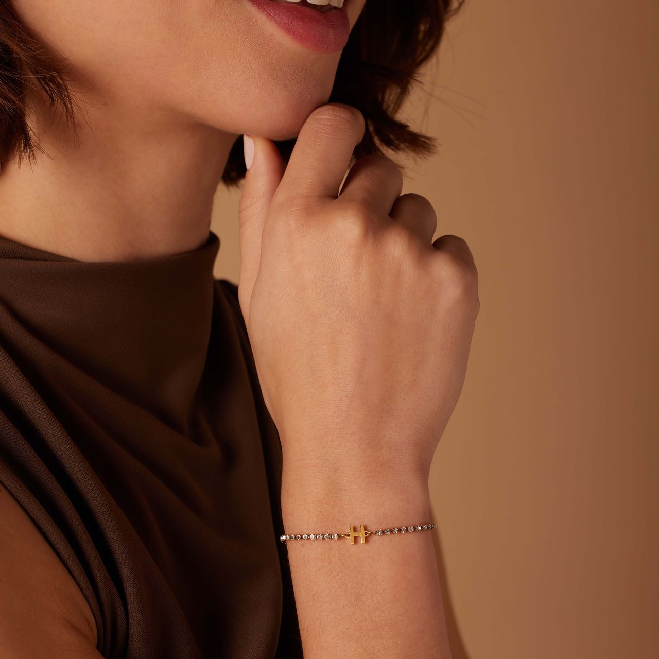 Stainless steel goldplated fantasiearmband met letterhanger H met zirkonia voor dames