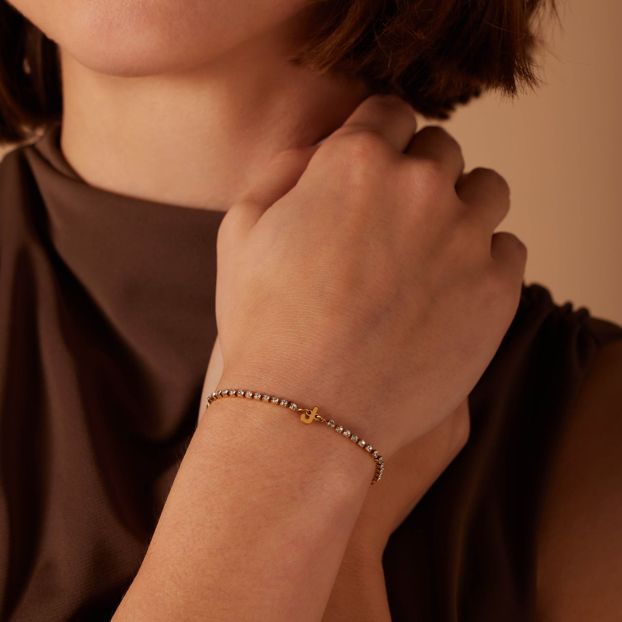 Stalen goldplated fantasiearmband met letterhanger J met zirkonia voor dames