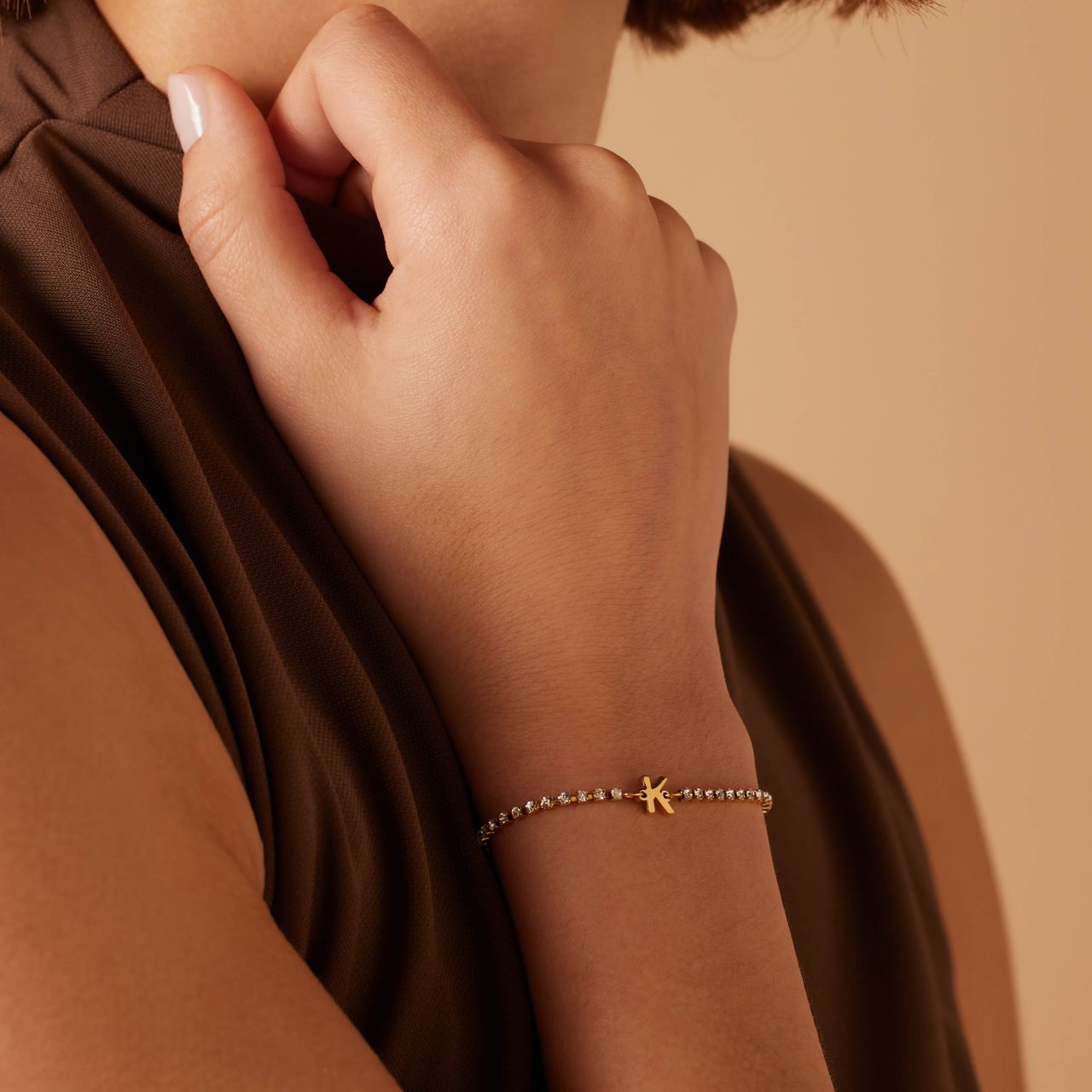 Stalen goldplated tennis armband wit cz letter - K