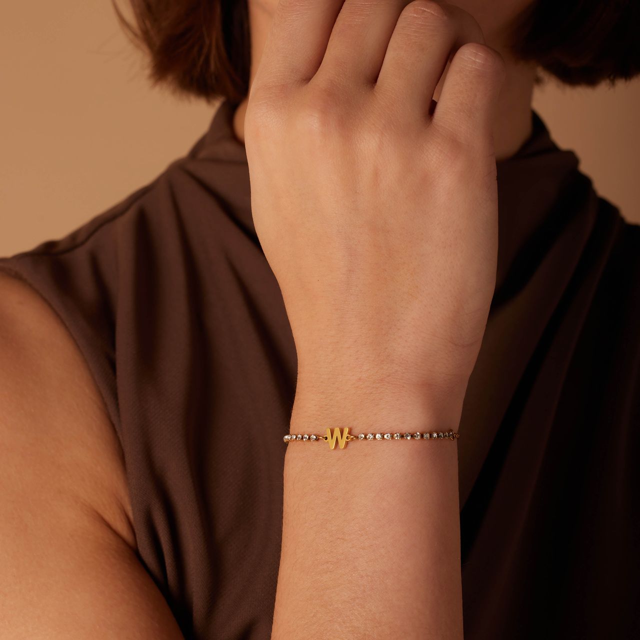 Stalen goldplated tennis armband wit cz letter - M